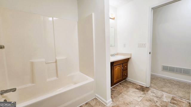 bathroom with baseboards, visible vents, shower / bathing tub combination, and vanity