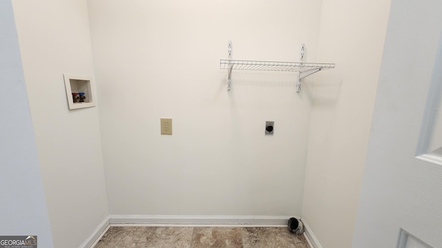 clothes washing area featuring laundry area, hookup for a washing machine, electric dryer hookup, and baseboards