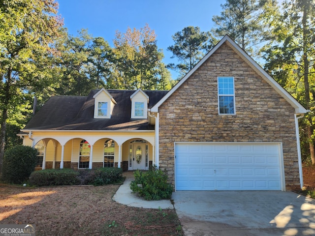 view of front of house featuring driveway and covered porch