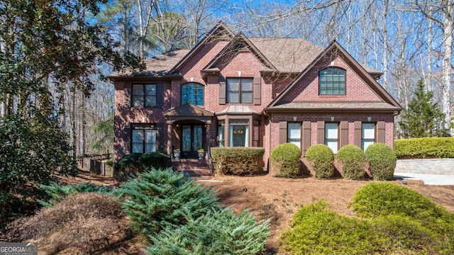 view of front of house featuring brick siding