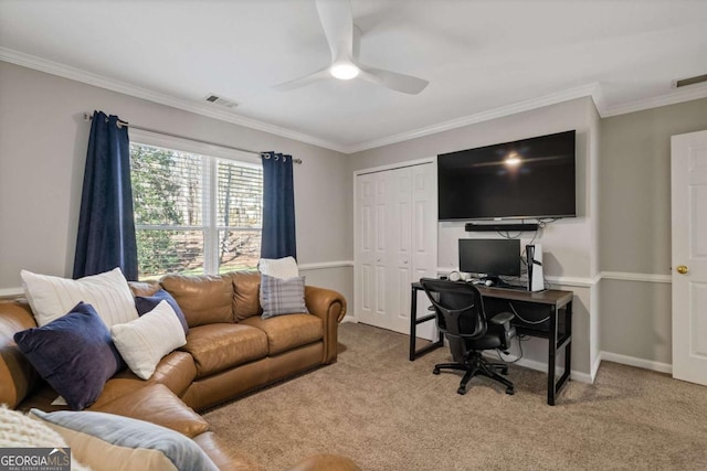 carpeted living area featuring visible vents, crown molding, baseboards, and ceiling fan