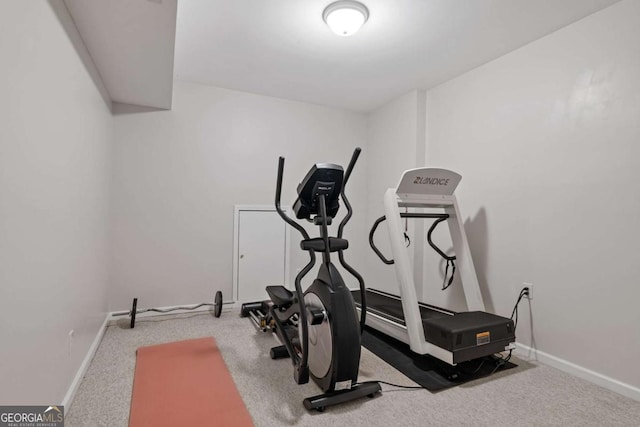 exercise area with carpet floors and baseboards