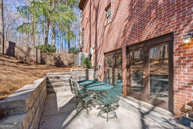 view of patio / terrace featuring outdoor dining space and fence