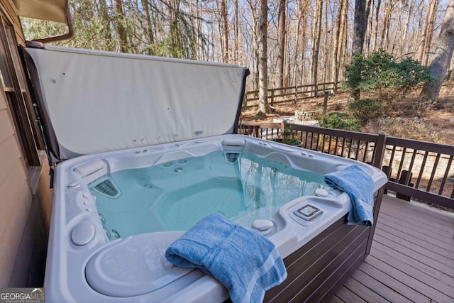 deck featuring a hot tub