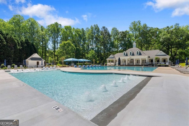 pool featuring a patio area and fence