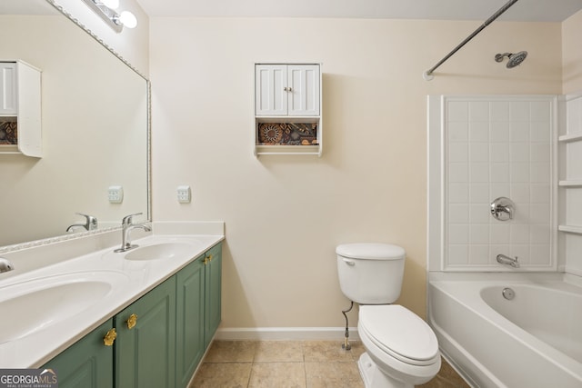 bathroom featuring toilet, tile patterned flooring, double vanity, and a sink