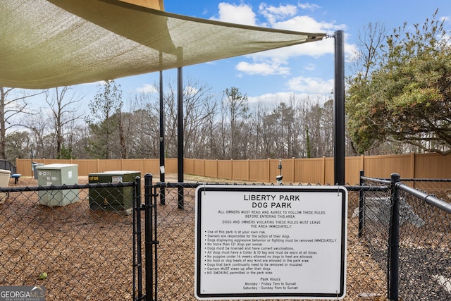 exterior details with a gate and fence