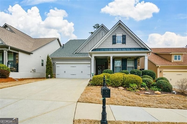 view of front of property featuring driveway, an attached garage, and board and batten siding