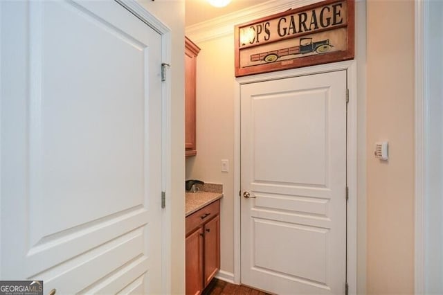 doorway featuring ornamental molding