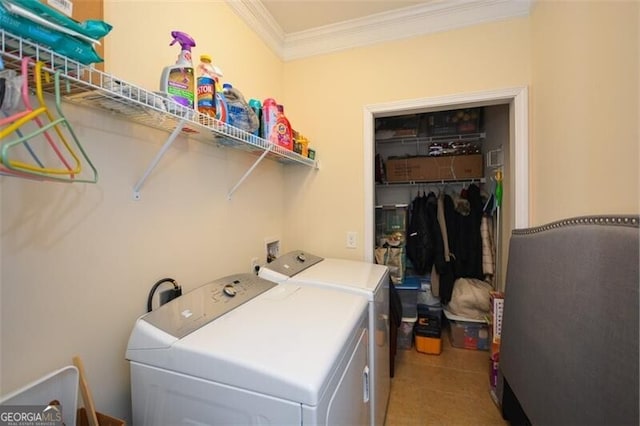 laundry room with washing machine and dryer, laundry area, and crown molding