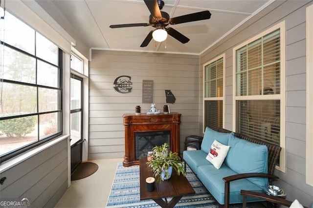 sunroom featuring a ceiling fan