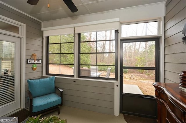 sunroom / solarium with plenty of natural light and ceiling fan