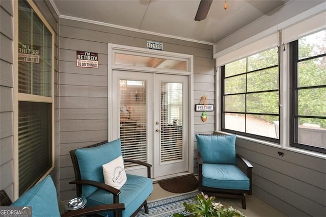 sunroom featuring french doors and ceiling fan