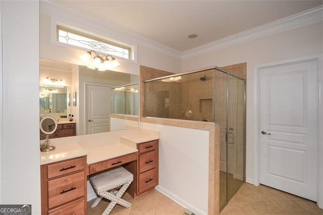 bathroom featuring ornamental molding, a stall shower, tile patterned flooring, and vanity