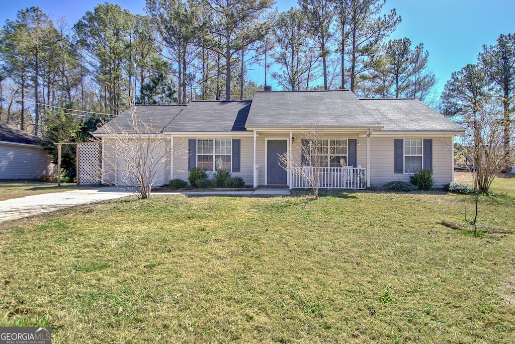 ranch-style house with a garage, a front yard, concrete driveway, and covered porch