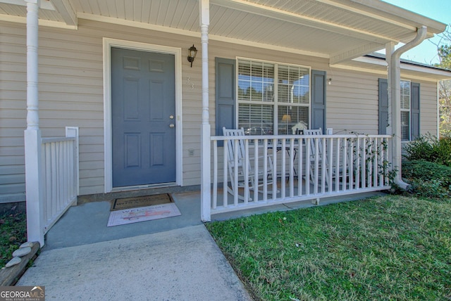 property entrance featuring covered porch