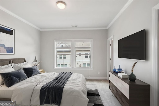 bedroom with visible vents, light carpet, baseboards, and crown molding