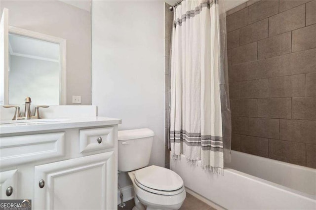 bathroom with vanity, toilet, and shower / bath combo with shower curtain