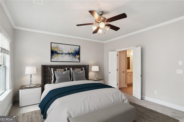 carpeted bedroom featuring ceiling fan, connected bathroom, crown molding, and baseboards