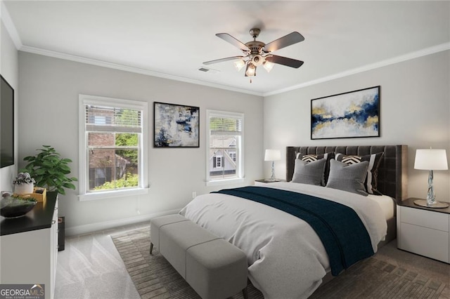 carpeted bedroom featuring multiple windows, crown molding, baseboards, and ceiling fan