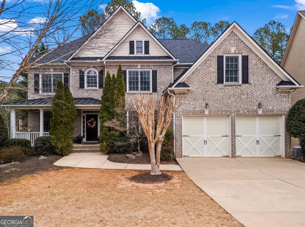 1903 Brackendale Rd NW, Kennesaw, GA 30152 - view of front of home with central AC, brick siding, and concrete driveway