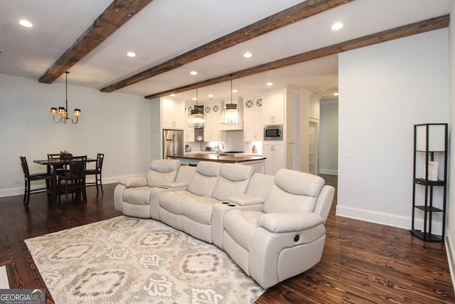 living area featuring baseboards, dark wood finished floors, beam ceiling, and recessed lighting