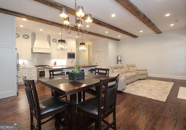 dining room with dark wood-style floors, beam ceiling, a notable chandelier, and baseboards