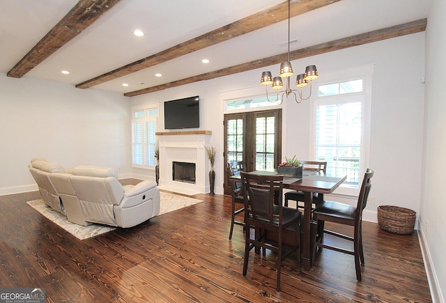 dining room featuring dark wood-style floors, french doors, and baseboards