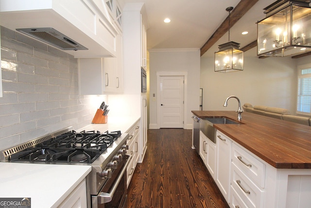 kitchen featuring range hood, white cabinetry, a sink, wood counters, and gas range