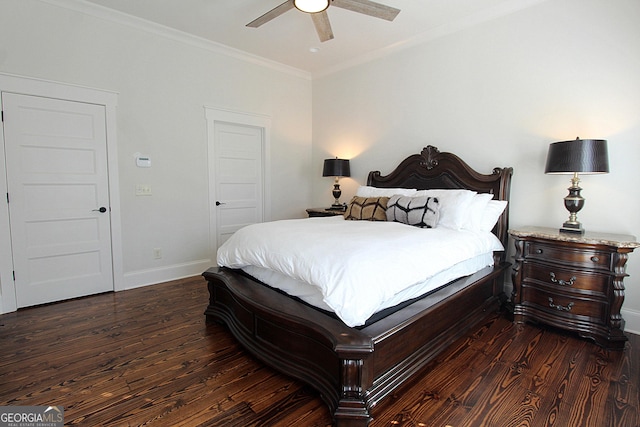 bedroom featuring baseboards, ornamental molding, ceiling fan, and wood finished floors