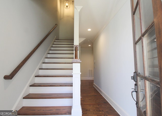 stairway featuring visible vents, baseboards, wood finished floors, and recessed lighting