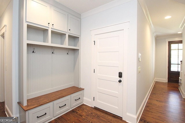 mudroom with crown molding, baseboards, dark wood-style flooring, and recessed lighting