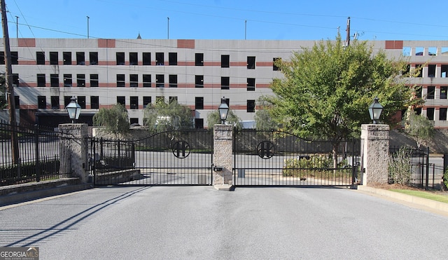 view of gate featuring fence