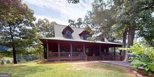 view of front of home with a porch and a front yard