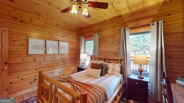 1650 Loving Rd, Morganton, GA 30560 - bedroom with ceiling fan, wood walls, and wood finished floors