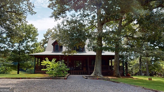 view of front facade with a porch and a front yard