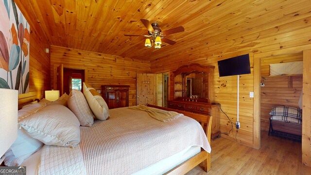 1650 Loving Rd, Morganton, GA 30560 - bedroom featuring wooden walls and wood finished floors