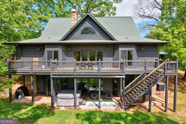 1650 Loving Rd, Morganton, GA 30560 - rear view of house with a wooden deck, a hot tub, and a patio area