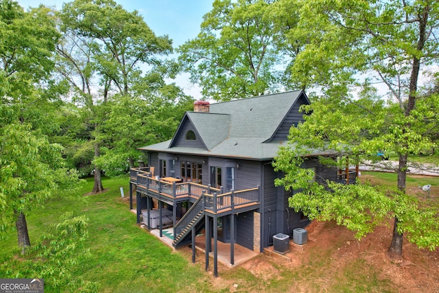 1650 Loving Rd, Morganton, GA 30560 - rear view of property with a shingled roof, a deck, a chimney, cooling unit, and a lawn