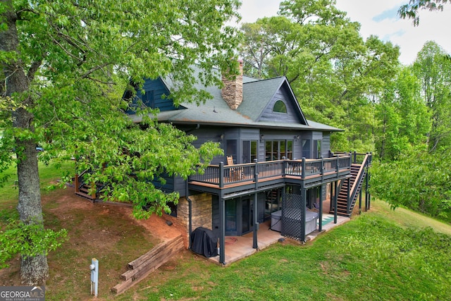 1650 Loving Rd, Morganton, GA 30560 - back of property with a chimney, a deck, stairway, a patio, and a shingled roof