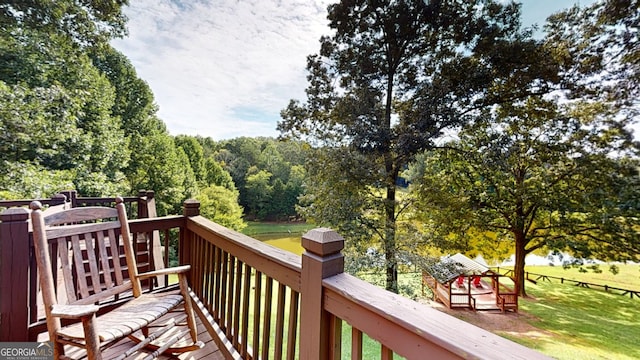 wooden terrace with a yard