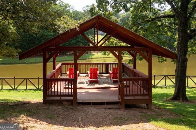 deck with a yard, fence, and a gazebo