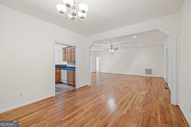 902 Grove Level Rd, Maysville, GA 30558 - unfurnished living room with a chandelier, light wood-style floors, arched walkways, and ceiling fan