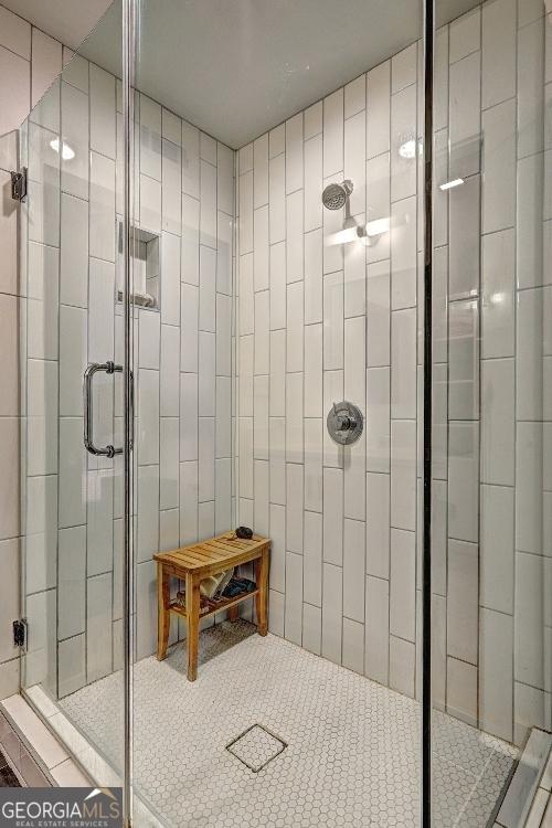 bathroom featuring a stall shower