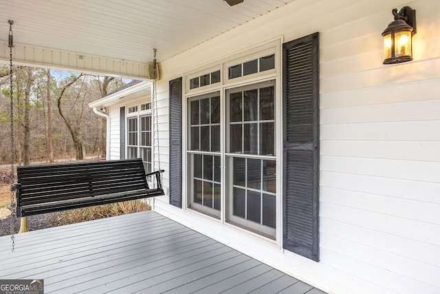 wooden terrace with a porch