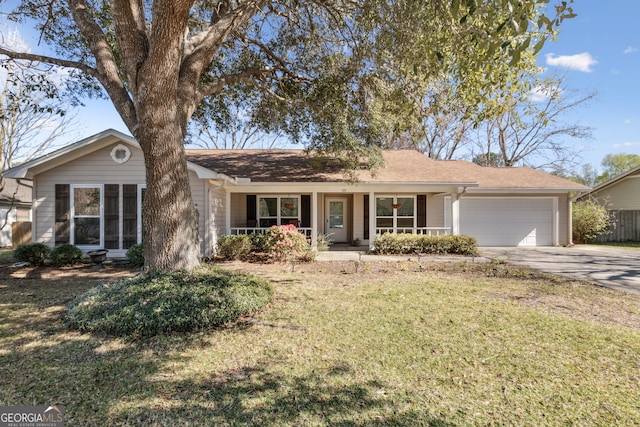 ranch-style house with a garage, driveway, a front lawn, and a porch