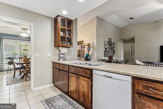 kitchen with light tile patterned floors, white dishwasher, visible vents, and light countertops