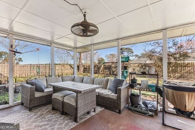 sunroom / solarium featuring a healthy amount of sunlight