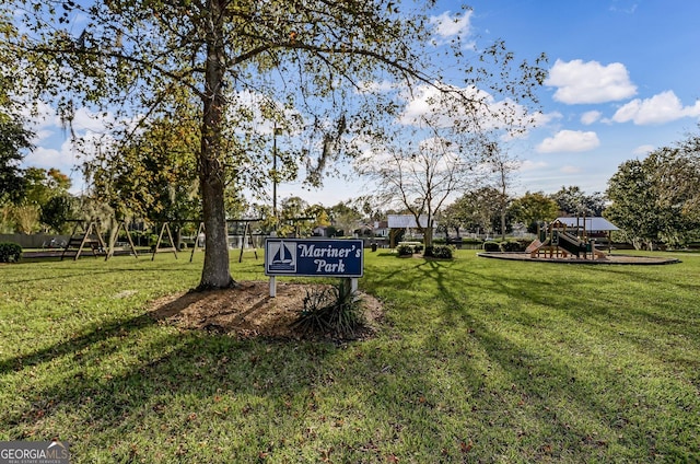 surrounding community featuring playground community and a yard