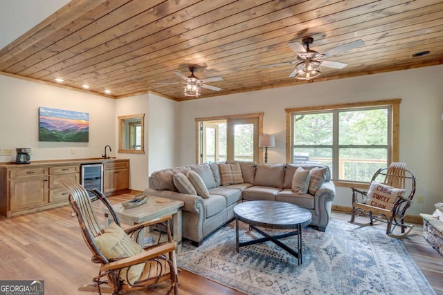 living area with light wood-type flooring, wooden ceiling, wine cooler, and a wealth of natural light